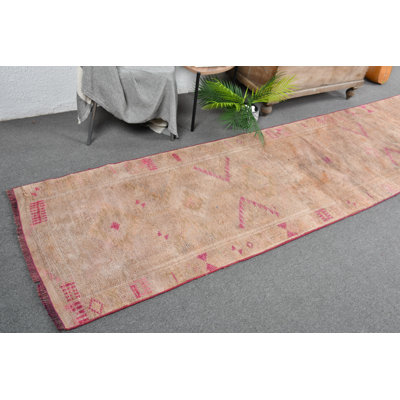 Vintage Turkish Runner Rug with Muted Pink Tones Perfect for a Boho Tribal Decor Theme Pink/Orange