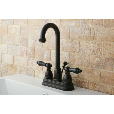 Kingston Brass Restoration Two-Handle 3-Hole Deck Mount 4" Centerset Bathroom Faucet with Plastic Pop-Up