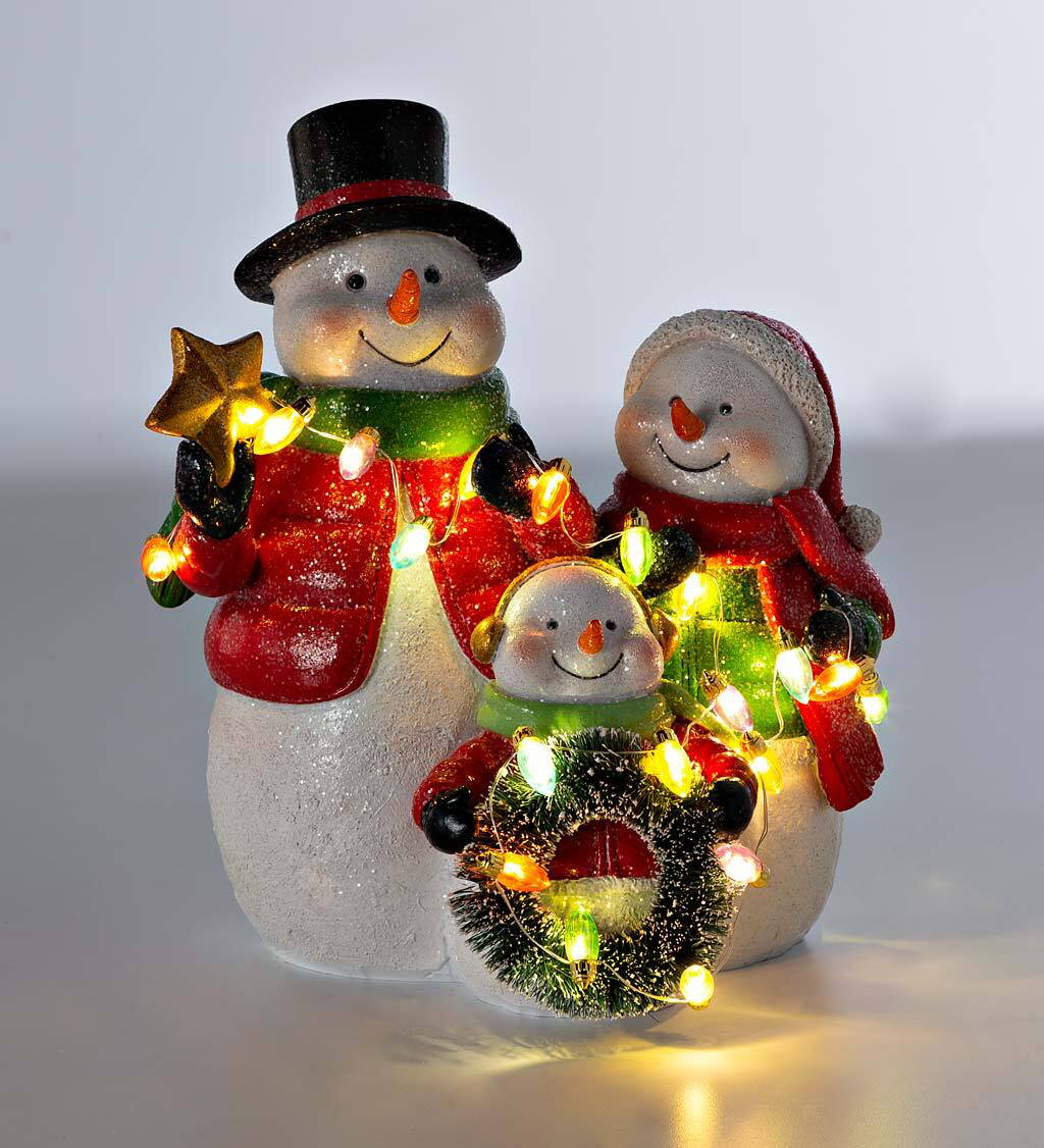 https://assets.wfcdn.com/im/26196193/compr-r85/2263/226353802/3-piece-snowman-figurine-set-with-christmas-lights.jpg