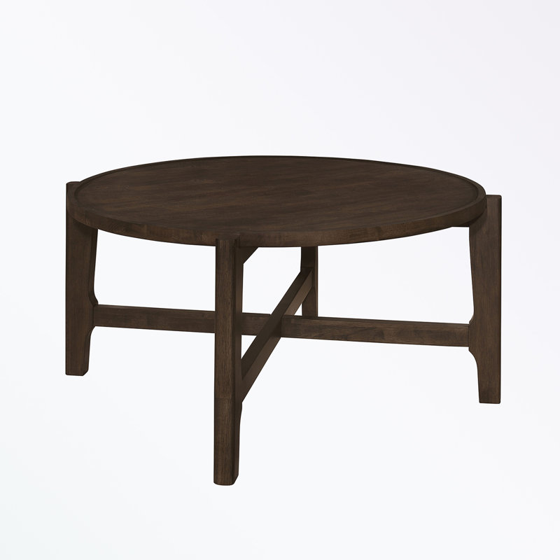 Table basse ronde en bois massif avec pieds robustes