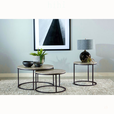 Table basse relevable Amara en chêne doré et noir avec finition imitation marbre pour des espaces de vie modernes et polyvalents