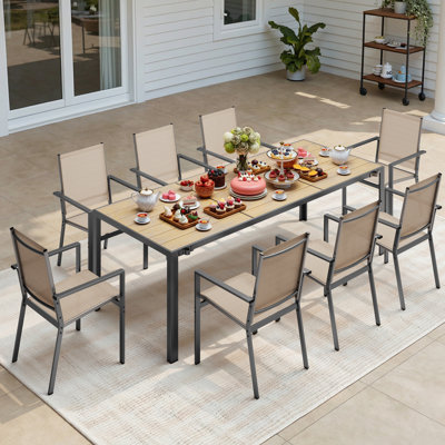 Ensemble de table de salle à manger 9 pièces pour patio avec 9 fauteuils empilables revêtus de polyester enduit de PVC