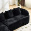Canapé de coin comprimé en chenille noire, garni de mousse souple haute élasticité, incurvé et doté de quatre coussins décoratifs. Parfait pour le salon et la chambre. Assise mi-ferme, support par ressorts.