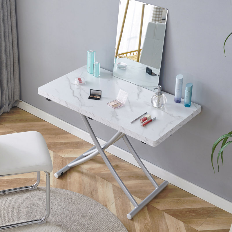 La table élévatrice multifonctionnelle moderne et minimaliste avec un bureau en panneau de fibres à densité moyenne de 0,8 pouce d'épaisseur et des pieds en métal argenté peut être utilisée comme coiffeuse, table basse, table de salle à manger et table de bureau. W1151126194