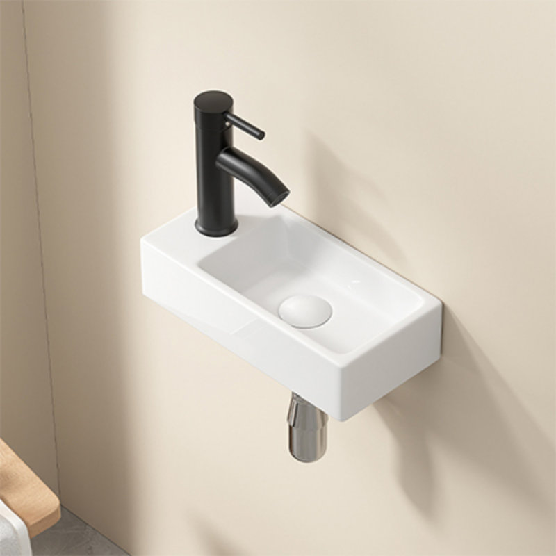 Lavabo mural en céramique blanc à droite sans robinet ni drain