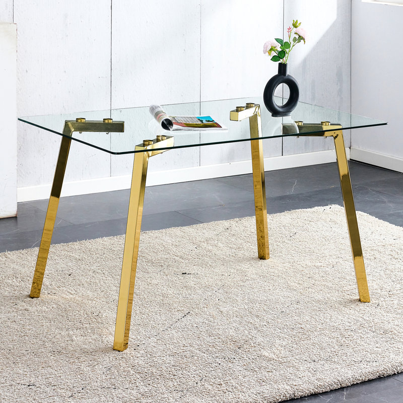 Table de salle à manger rectangulaire avec surface en verre trempé et pieds en métal doré, objet intérieur moderne au goût minimaliste