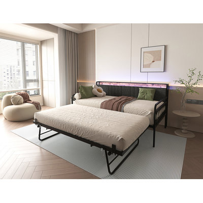 Daybed With Trundle, Upholstered Headboard, Charging Station And RGB LED Lighting For Modern Living Spaces.