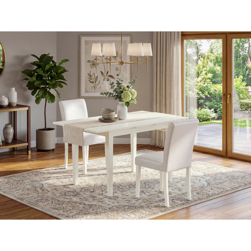 L'ensemble de table de cuisine 3 pièces comprend une table de salle à manger rectangulaire avec rallonge papillon et 2 chaises Parson en similicuir blanc, lin blanc