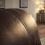 Fauteuil inclinable manuel en similicuir brun foncé avec accoudoirs rembourrés et repose-pieds extensible pour le cinéma maison
