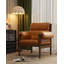 Cette chaise décorative en cuir ciré à l'huile de style ancien, avec une structure en bois, convient à une utilisation dans le salon.