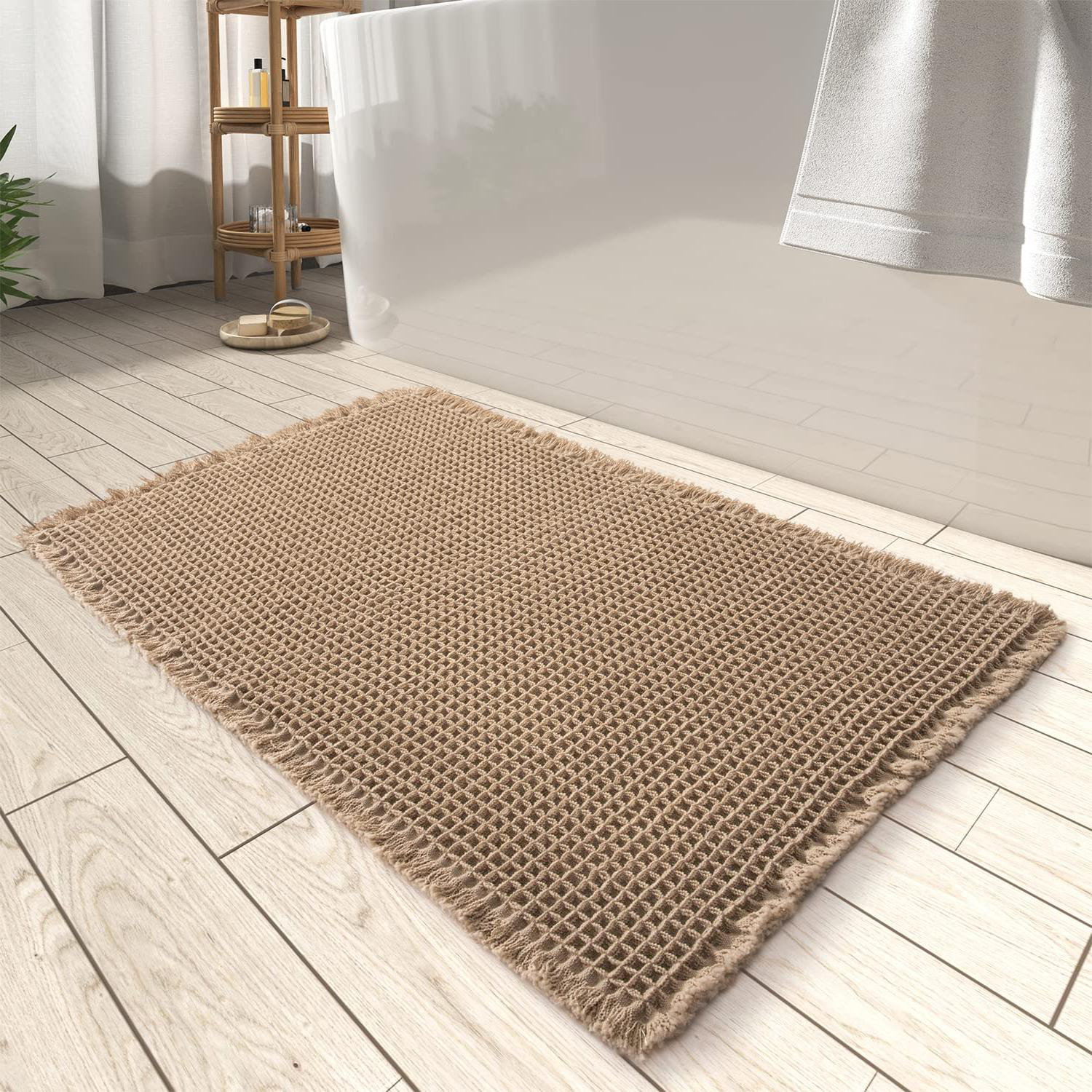 https://assets.wfcdn.com/im/26349238/compr-r85/2574/257410588/ilvis-bath-rug-with-non-slip-backing.jpg