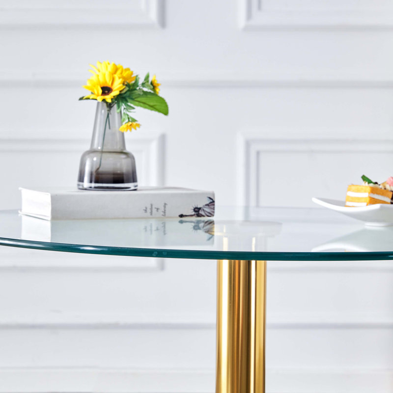 A glass tabletop with a modern minimalist circular dining table, 29.5" H x 35" L x 35" W, Gold