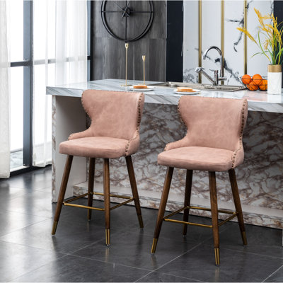 Pink Mid-Century Modern Counter Stools   Of 2  - Faux Leather , Nailhead Trim, Suede-Like Upholstery, Button Back, Tapered Walnut Legs, Gold Metal Footrest  2  Solid Wood