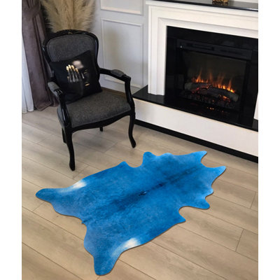 Tapis bleu uni en similicuir Novelty Helmine