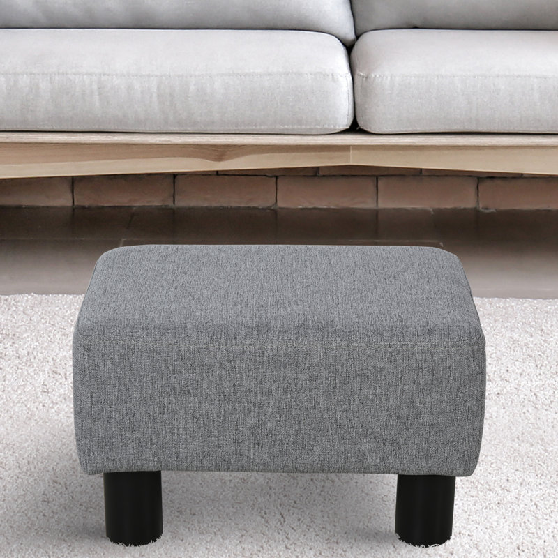 Tabouret gris avec tissu en lin et pieds en plastique pour un espace de détente et de détente, petite pièce élégante