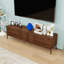 Contemporary TV Stand with Fluted Doors, Rounded Corners, Ample Storage and Cable Management