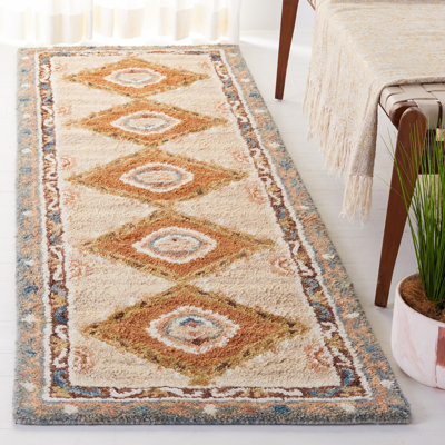 Arkadijus Southwestern Handmade Tufted Area Rug in Brown / Blue