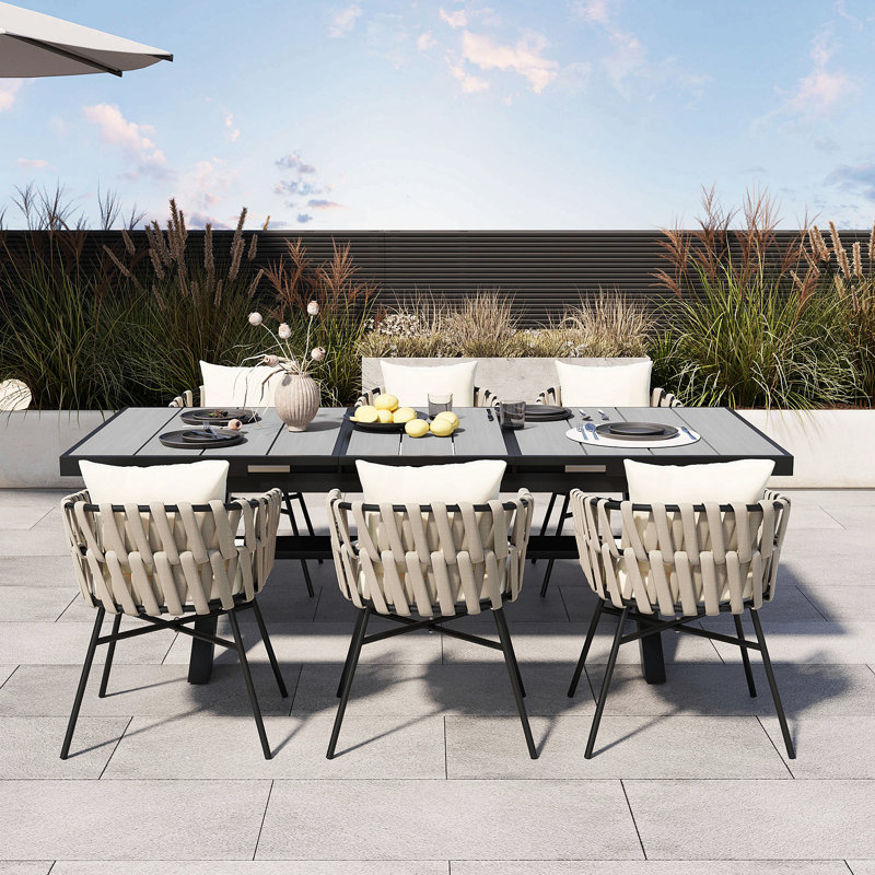 Discover Unmatched Flexibility In Alfresco Dining With Six Creatively Arranged Chairs Made Of Polyester Woven Tape And A Table That Expands From 62.9 To 82.6 Inches To Suit Any Occasion.