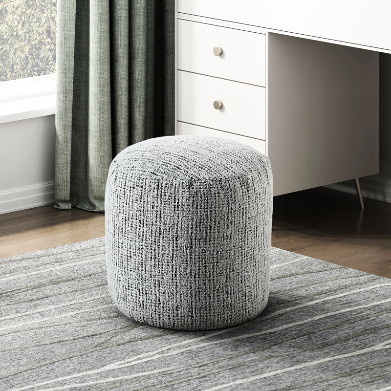 Repose-pieds cylindrique avec base antidérapante et revêtement en tissu d'ameublement en chenille