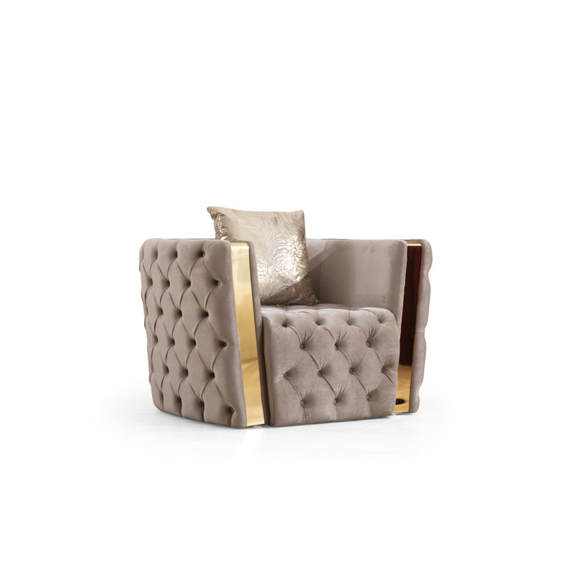 Fauteuil capitonné moderne avec boutons et tissu velours