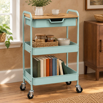 Un plateau de table et un tiroir organisent les essentiels sur ce chariot de cuisine à roulettes en métal vert menthe à 3 niveaux, avec des roues verrouillables pour une utilisation dans les salles de bain, les bureaux, les balcons, les salons et les s