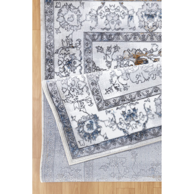 Tapis en polyester durable au design doux et traditionnel, parfait pour les espaces très fréquentés, les enfants et les animaux de compagnie