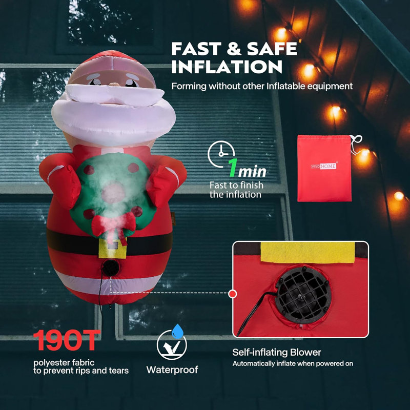 Père Noël illuminé gonflable avec une couronne brisée par la fenêtre