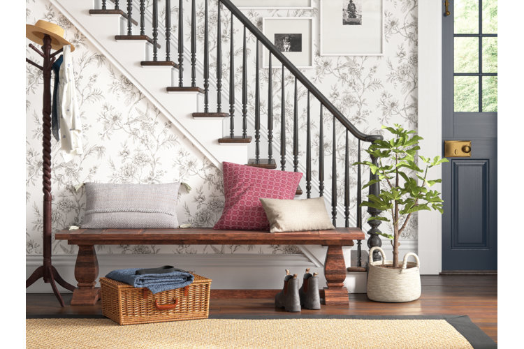 traditional-style entryway with a wood bench