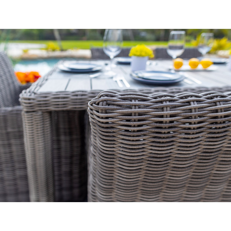 Malmo 6 - Person Wicker Patio Dining Set with Round Table , Cushions Included, Canvas Aruba Sunbrella® Canvas