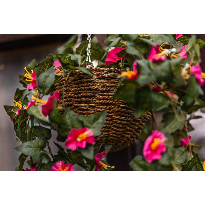 15cm Faux Flowering Plant in Wicker/Rattan Basket