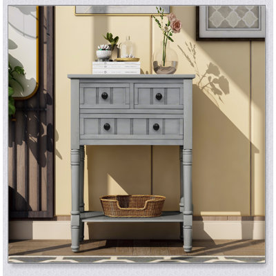 Console étroite avec trois tiroirs de rangement et une tablette inférieure, parfaite pour organiser et améliorer les petits espaces
