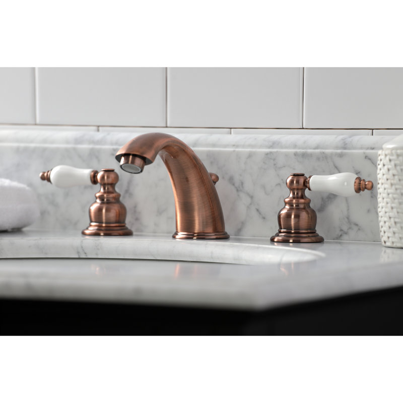 Kingston Brass Magellan Two-Handle 3-Hole Deck Mount Widespread Bathroom Faucet with Retail Pop-Up Drain, Antique Copper