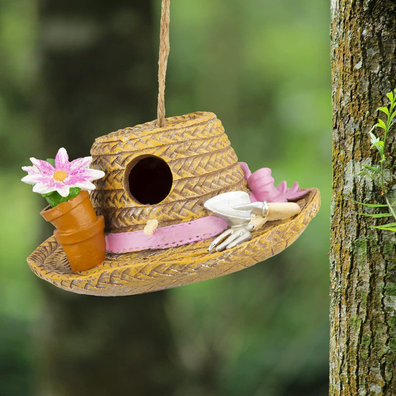 Maison d'oiseaux décorative avec chapeau de paille
