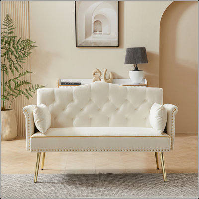 CanapÃ© 2 places blanc crÃ¨me avec dossier et assise capitonnÃ©s, idÃ©al pour les petits espaces.