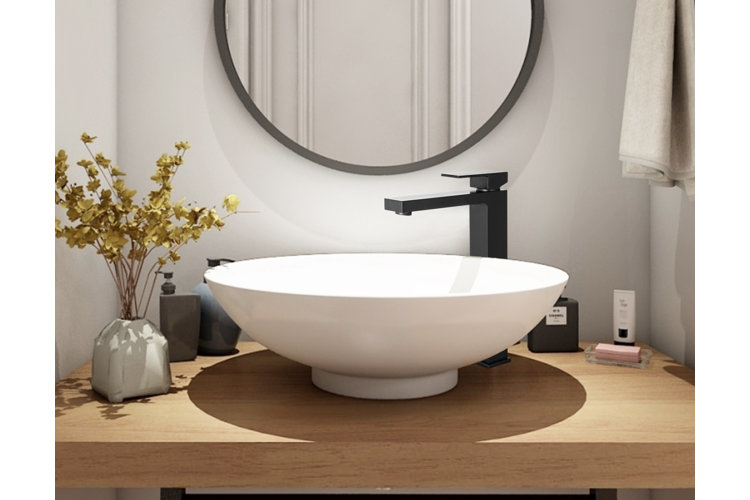 white vessel sink on a solid wood counter top