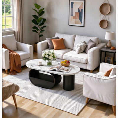 Winchester 47.24'' W Oval Stone and Faux Marble Coffee Table with Iron Base