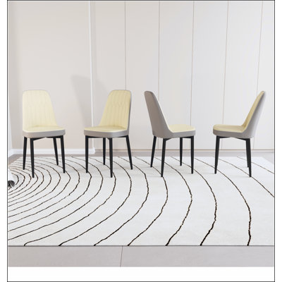 Chaises de salle à manger modernes en cuir de polyuréthane avec des coussins moelleux épais et des pieds en métal durables, parfaites pour le confort de la cuisine et de la salle à manger.
