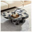 Table basse moderne en faux travertin texturé avec forme de papillon en noir et beige