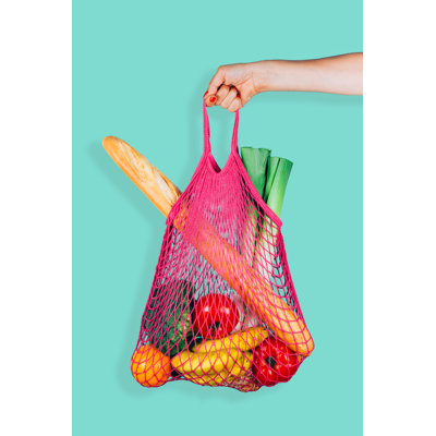 Hand Holding Reusable Bag by ASIFE - Wrapped Canvas Print
