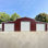 Garage en métal de 42 pi x 30 pi pour la maison et la ferme, acier vieilli, 14 cadres, 26 panneaux, trois portes roulantes, entrée latérale, fenêtre, finition rouille rouge, rangement pour outils de 15 à 20 ans