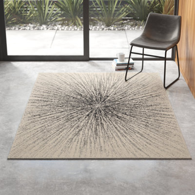 Tapis noir et ivoire à motif abstrait