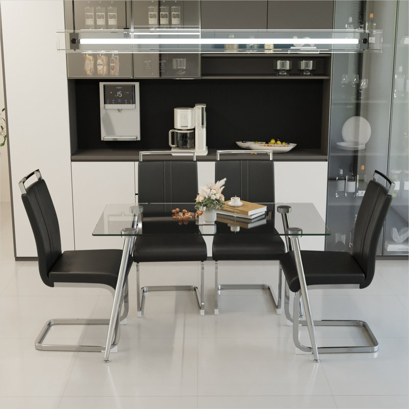 Ensemble de salle à manger pour 4 personnes en verre trempé avec pieds galvanisés argentés et chaises en similicuir, table rectangulaire transparente