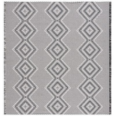 Tapis tissé à la machine de style sud-ouest Belniak en ivoire / noir