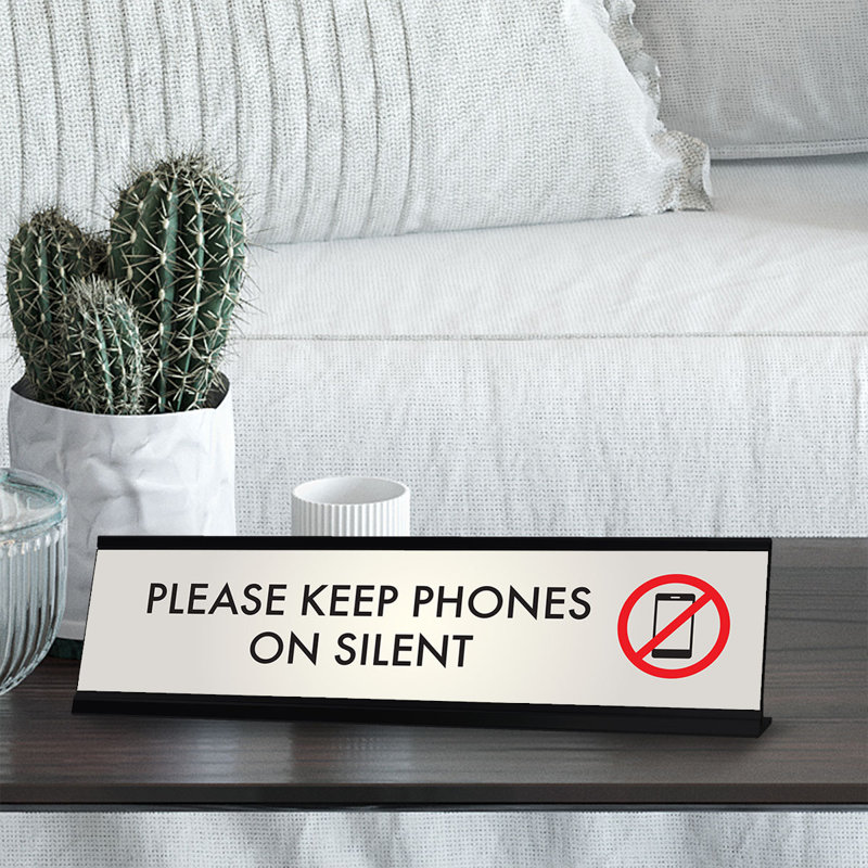 Veuillez garder les téléphones sur l'enseigne de bureau silencieuse
