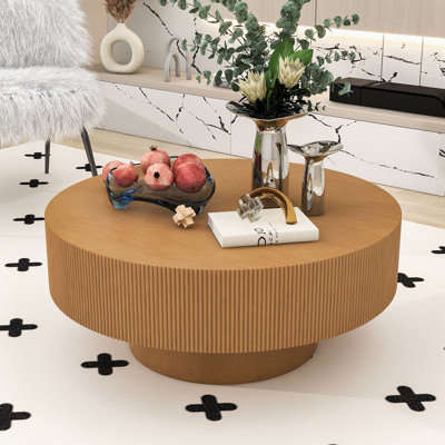 Table basse ronde avec plateau en bois aggloméré épais, base cylindrique cannelée, table centrale contemporaine pour l'espace détente