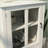 Buffet storage cabinet with single glass doors and unique bell handle-1433796088