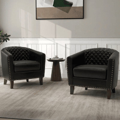 Fauteuil demi-tonneau capitonné en similicuir noir Edvardas