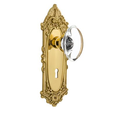 Plaque victorienne avec trou de serrure décoratif et poignée de porte ovale en cristal transparent