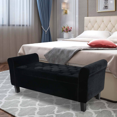 Banc de rangement rembourré à l'extrémité du lit