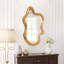 Miroir mural de forme irrégulière avec cadre en bois naturel